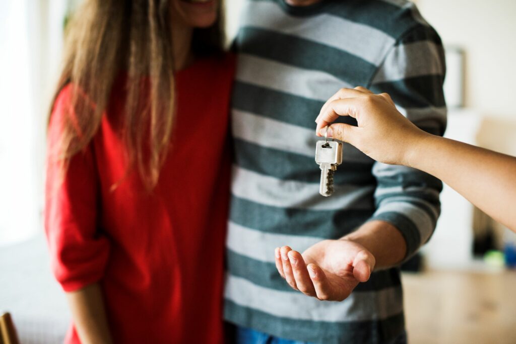 Couple collecting keys for new rental property
